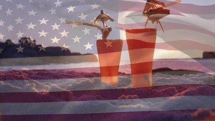 Two cocktails in the beach and an American flag for 4th of July - Powered by Adobe