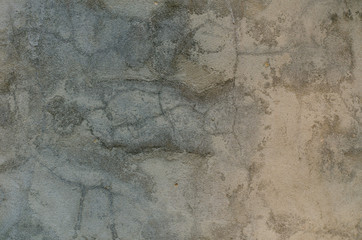A lot of cracks on an old painted wall. Abstract grunge background