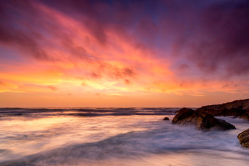 Pink Sunset over Ocean, Waves, Rocky Beach