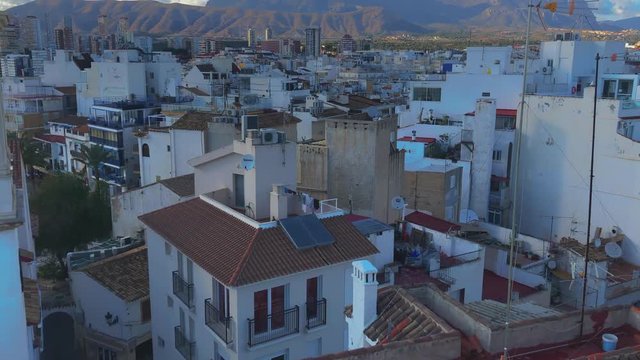 White houses, red rooftops and mountains of Benidorm, Spain Tilit View
