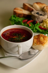 National Jewish borsch with pumpushki and greens