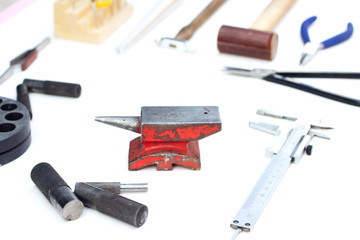 anvil, hammer. tools for jewelry forging. isolated on white background. Jewelrymaking goldsmith background