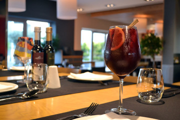 glass of sangria on table in restaurant