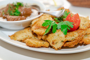 National Jewish dish - Fleish mit latex - beef stew with potato pancakes