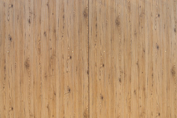 Beautiful light brown wooden surface of rough wood texture with natural small dark spot of the piths. 
