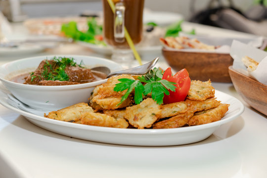 National Jewish dish - Fleish mit latex - beef stew with potato pancakes