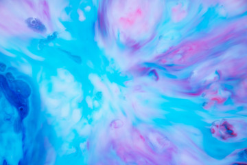 Fototapeta na wymiar Sublime Galaxy Abstract Background Texture. Stunning and enchanting swirls of vibrant blues and pinks. Graphic resource. Feeling of space, the ocean and dreams are evoked. Magical landscape. 