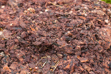 A pile of brown mulch