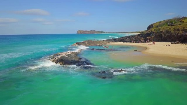 Aerial Forward: People Bathing in Scenic Cove with Beautiful Beach, Fraser Island, Australia
