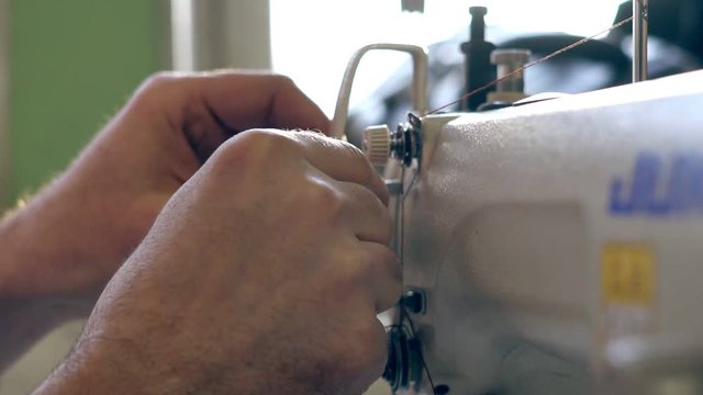 the master threads into the sewing machine