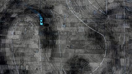 Aerial view of professional driver drifting car on race track. © Kalyakan