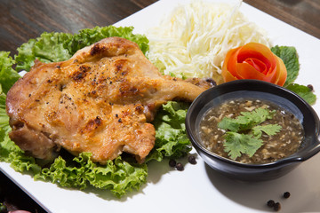 grilled chicken with Thai style dipping spicy sauce for roasted or grilled food (fish sauce and chilli)