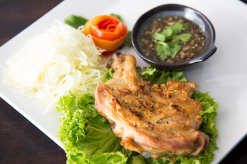 grilled chicken with Thai style dipping spicy sauce for roasted or grilled food (fish sauce and chilli)