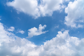 Obraz premium Sunshine white clouds sky during morning like in the heaven, soft focus lens flare sunlight. Abstract blurred cyan gradient of peaceful nature. Open view out windows beautiful summer spring