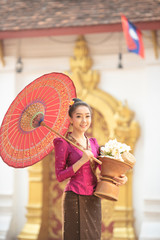 Lao girl dressed in traditional Lao clothes Beautiful Laos girl in Laos costume,Asian woman wearing...
