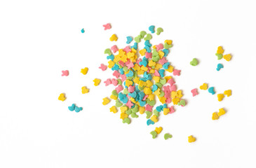Candy sprinkles. Colorful cake sprinkles scattered over white background.