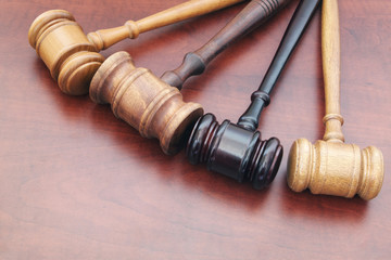 Many judge gavels on table, many courts and law concept, different court decisions