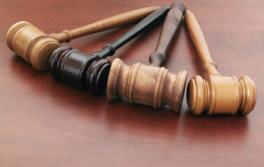Many judge gavels on table, many courts and law concept, different court decisions