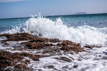 waves crashing on rocks
