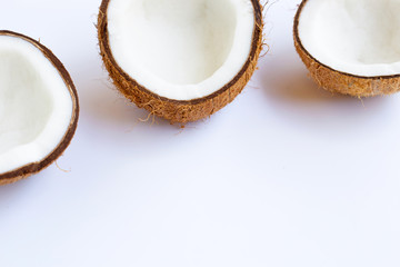 Ripe coconuts on white.