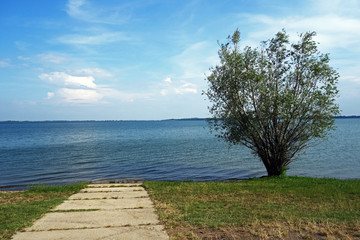 Fototapeta na wymiar Empty harbor at lake with concrete panels