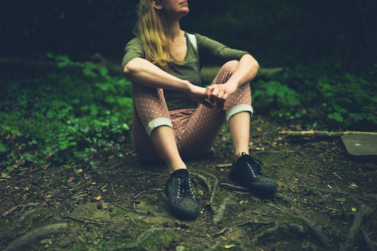 Young woman relaxing in the woods