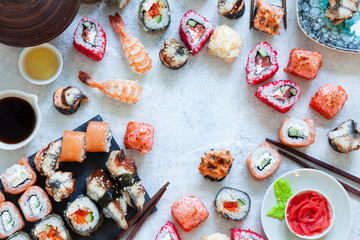 Top view of japanese sushi set nigiri and sushi rolls served with wasabi and ginger