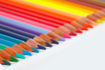 The colored pencils on the white table