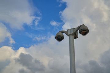 security CCTV pillar on blue sky and cloud