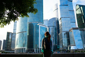 Fototapeta na wymiar Portrait of young woman walking on the street, wearing cute trendy jacket.
