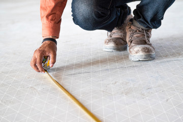 Measuring the distance in the construction and interior decoration of the building by skilled technicians. There are graphics, grid lines to display.