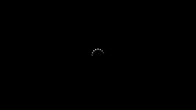 A white loading icon spins around in a black space on screen as operating system boots.