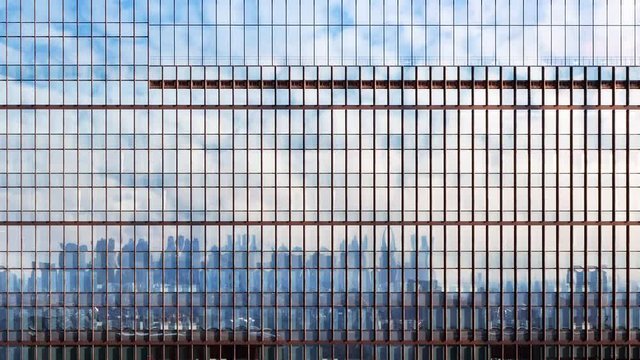 Clouds reflected in windows of facades building.