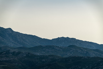 Fototapeta na wymiar Mountains and citadel in Saint - Florent, Corsica