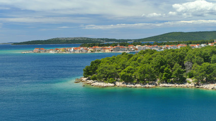 Naklejka premium Dark blue sea along beatiful Dalmatia Coast with small historic villages and pine trees, Croatia