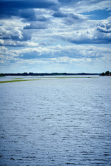 beautiful rain clouds over the blue river