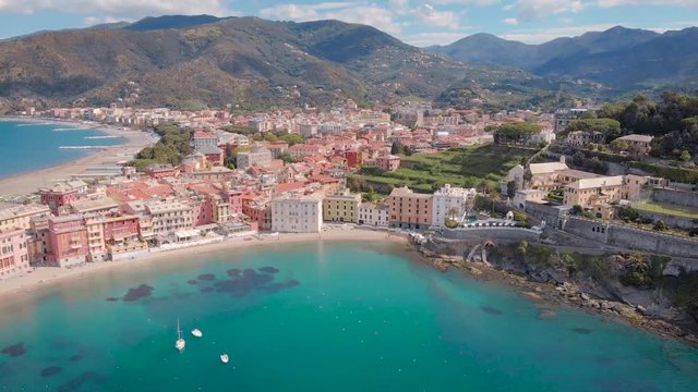 Breathtaking 4K aerial view of beautiful Sestri Levante town in mediterranean sea, incredible turquoise sea.