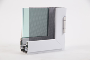 Cut of the window profile with metal, glass and insulation