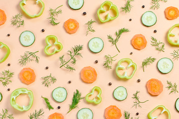 Salad ingredients layout. Food pattern with cherry tomatoes, carrot, cucumbers, radish, greens, pepper and spices