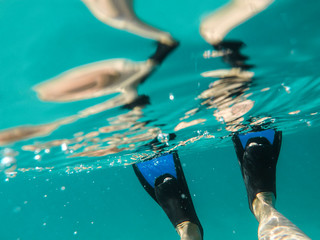 Diving flippers underwater © Glyph_stock