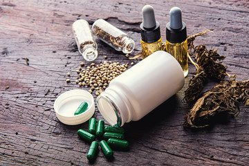Medical marijuana concept, hemp cannabis natural products  with lotion black wooden table top