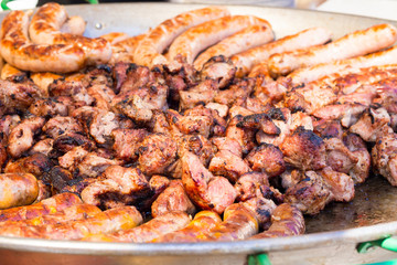 meat and sausages are roasted on the coals. street food. fast food
