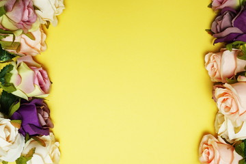 Roses flower bouquet border frame with space copy on yellow background