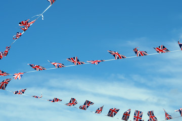 English flags against a blue sky