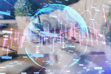 Fototapeta na wymiar Financial forex graph displayed on hands taking notes background. Concept of research. Multi exposure