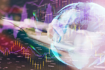 Financial forex graph drawn over hands taking notes background. Concept of research. Multi exposure