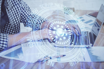 Obraz premium Businessman working on Laptop with technology theme drawing. Concept of big data. Double exposure.