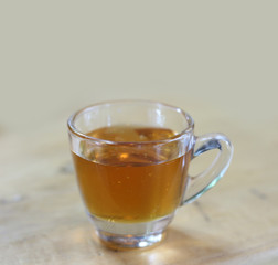 honey in glass on wood background