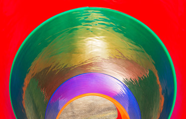 Colorful inside view of a round slide.