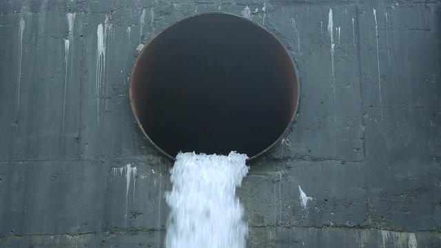 From a huge sewer endlessly flowing water from the mountains